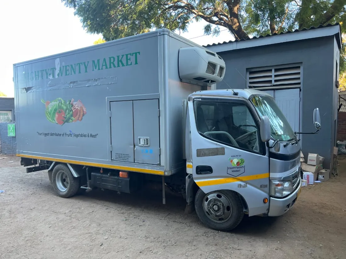 8020 Market branded delivery truck