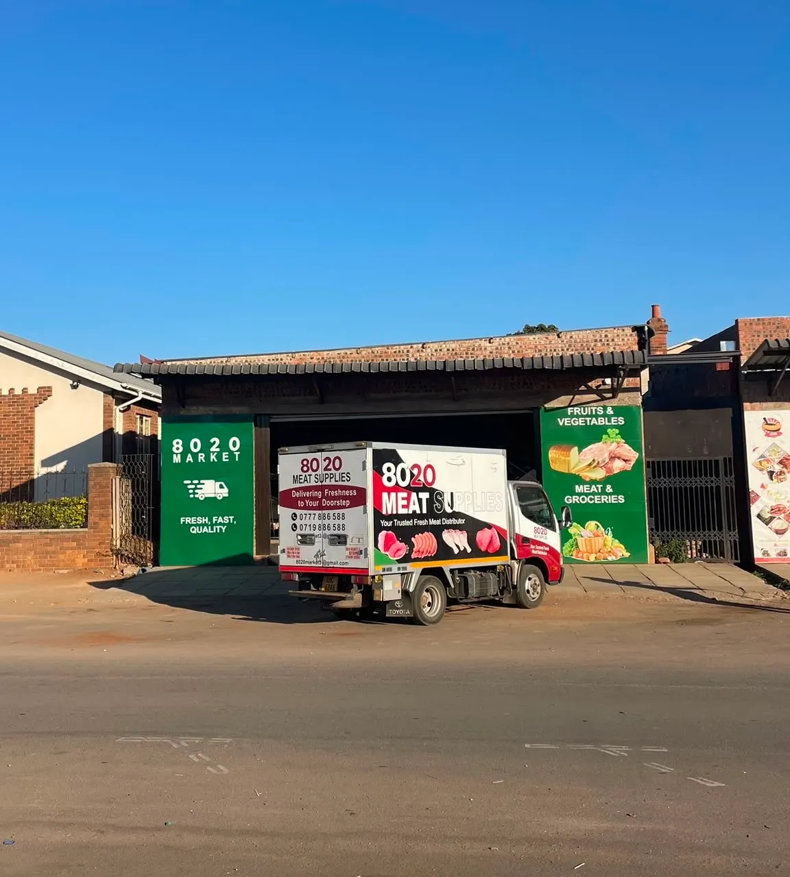 8020 Meat Supplies truck outside the store