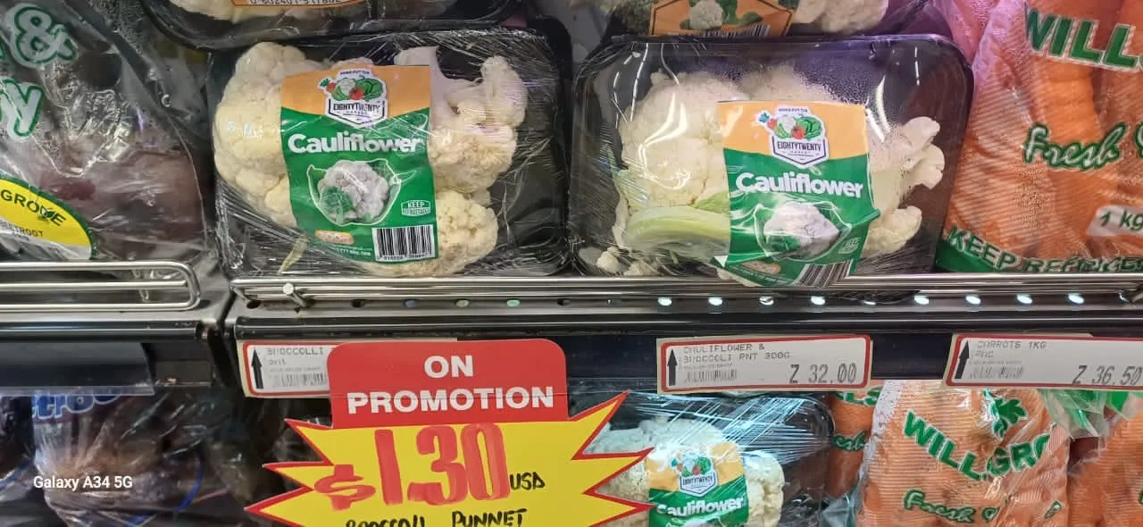 8020 Market branded cauliflower on a retail shelf