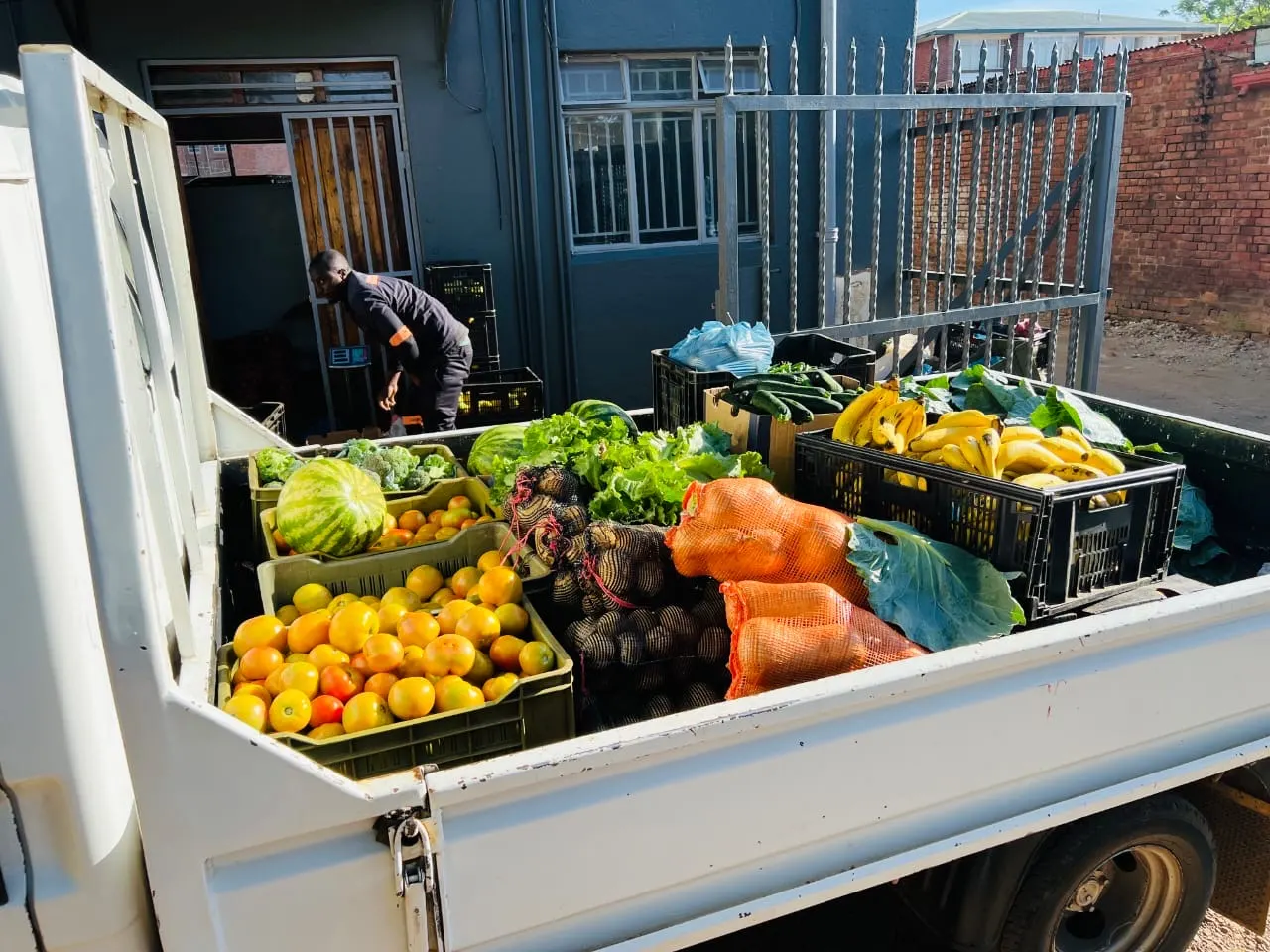 8020 Market staff unloading a delivery